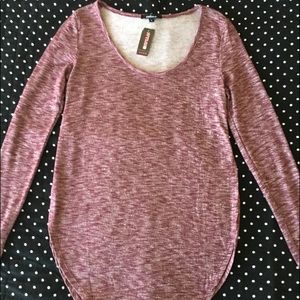 Reddish pink, long sleeve top w/high side slits.